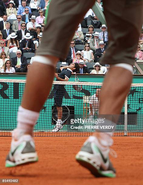 Swiss player Roger Federer serves to Spanish player Rafael Nadal during their French tennis Open final match at Roland Garros on June 08, 2008 in...