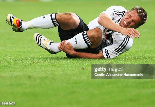 Lukas Podolski of Germany looks painful during the UEFA EURO 2008 Group B match between Germany and Poland at Worthersee Stadion on June 8, 2008 in...