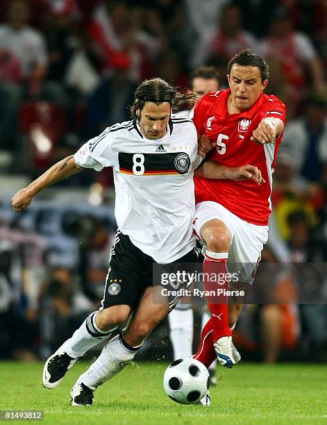 Torsten Frings of Germany and Dariusz Dudka of Poland battle for the ball during the UEFA EURO 2008 Group B match between Germany and Poland at...