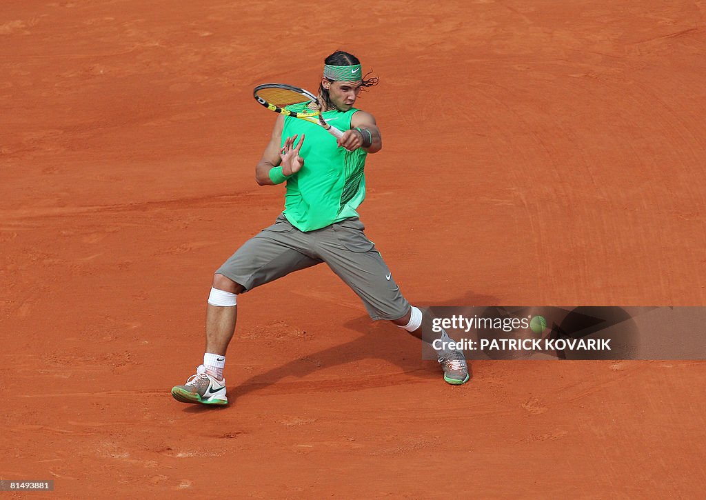 Spanish player Rafael Nadal returns a s