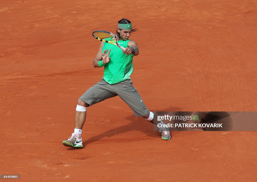 Spanish player Rafael Nadal  returns a s