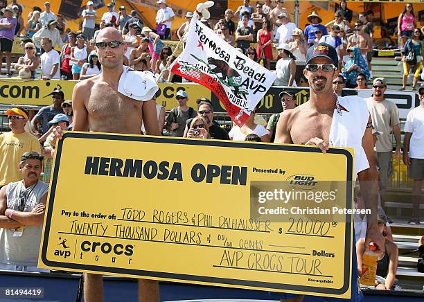 Phil Dalhausser and Todd Rogers pose with the winners check after winning the AVP Hermosa Beach Open final on June 8, 2008 at the Pier in Hermosa...