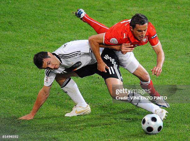 German forward Miroslav Klose and Polish midfielder Dariusz Dudka vie during their Euro 2008 Championships Group B football match Germany vs. Poland...