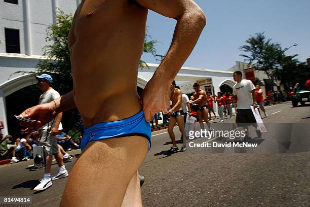 Marcher adjusts his Speedo style swim suit at the 38th annual LA Pride Parade June 8, 2008 in West Hollywood, California. California gay people are...