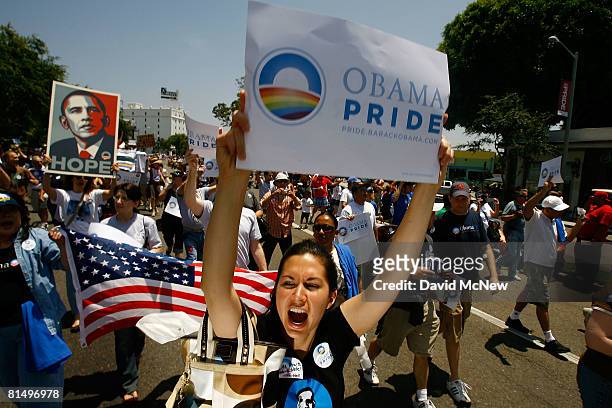 Gay pride participants hold signs in support of Democratic presidential hopeful Barack Obama at the 38th annual LA Pride Parade June 8, 2008 in West...