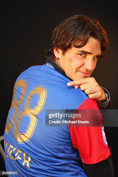 Roger Federer of Switzerland wearing a FC Basle football shirt on day six of the Masters Series at the Monte Carlo Country Club, April 24, 2008 in...