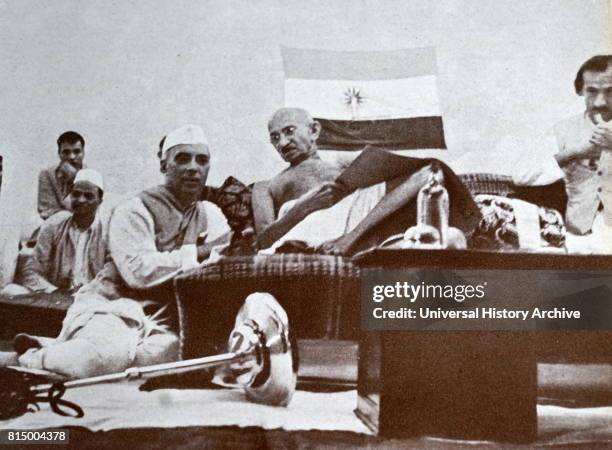 Mohandas Karamchand Gandhi at a meeting with Jawaharlal Nehru and Jivatram Kripalani , 1940. Gandhi was the preeminent leader of the Indian...