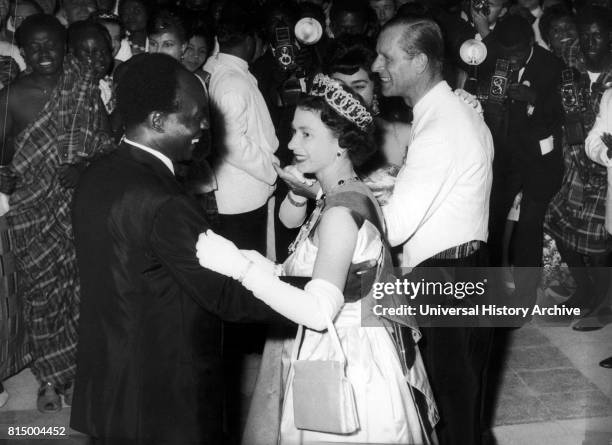 Queen Elizabeth II of Great Britain dances with President Kwame Nkrumah of Ghana, during her visit to Accra, Ghana, in 1961.