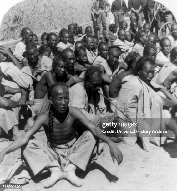 Chinese Boxer prisoners captured and brought in by 6th U.S. Cavalry, Tientsin, China during the suppression of the Boxer Rebellion 1901.