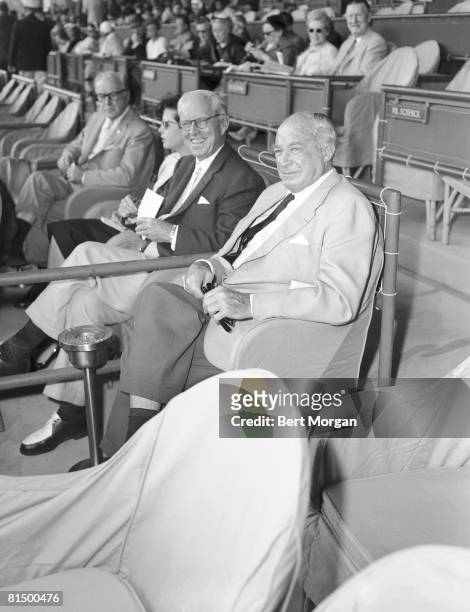 American diplomat and financier Joseph P. Kennedy Sr. And retail mogul Bernard F. Gimbel sit together in the stands at the Hialeah Park Race Track,...