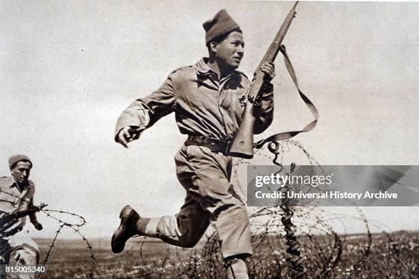 Greek soldier running during combat in the Greek civil War 1948.