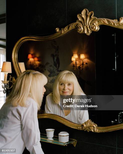 Actress Mireille Darc poses at a portrait session for Point de Vue in Paris on May 21, 2008. .