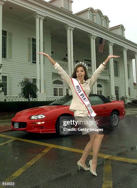 Kimberly Ann Pressler, Miss USA 1999, of Franklinville New York, poses for photographers Saturday, Feb. 6, 1999 in front of her new Camaro at The...