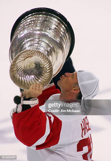 Goaltender Dominik Hasek of the Detroit Red Wings kisses the Stanley Cup after defeating the Pittsburgh Penguins 3-2 in game six of the 2008 NHL...