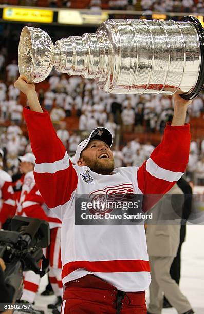Kirk Maltby of the Detroit Red Wings hoists the Stanley Cup after defeating the Pittsburgh Penguins 3-2 in game six of the 2008 NHL Stanley Cup...