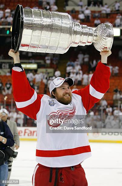 Niklas Kronwall of the Detroit Red Wings hoists the Stanley Cup after defeating the Pittsburgh Penguins 3-2 in game six of the 2008 NHL Stanley Cup...
