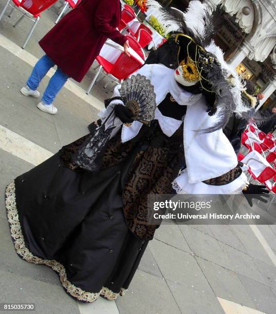 Costumed attendee at the Venice Carnival , an annual festival held in Venice, Italy. Started to recall a victory of the 'Serenissima Repubblica'...