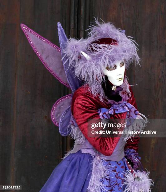 Costumed attendee at the Venice Carnival , an annual festival held in Venice, Italy. Started to recall a victory of the 'Serenissima Repubblica'...