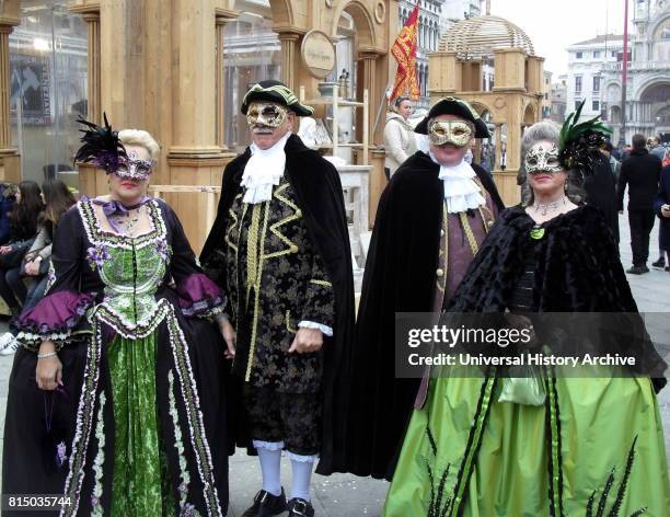 Costumed attendees at the Venice Carnival , an annual festival held in Venice, Italy. Started to recall a victory of the 'Serenissima Repubblica'...