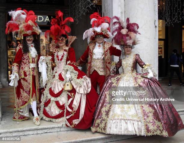 Costumed attendees at the Venice Carnival , an annual festival held in Venice, Italy. Started to recall a victory of the 'Serenissima Repubblica'...