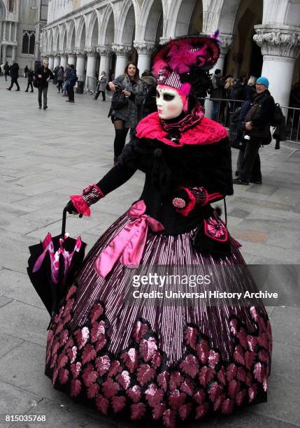 Costumed attendee at the Venice Carnival , an annual festival held in Venice, Italy. Started to recall a victory of the 'Serenissima Repubblica'...