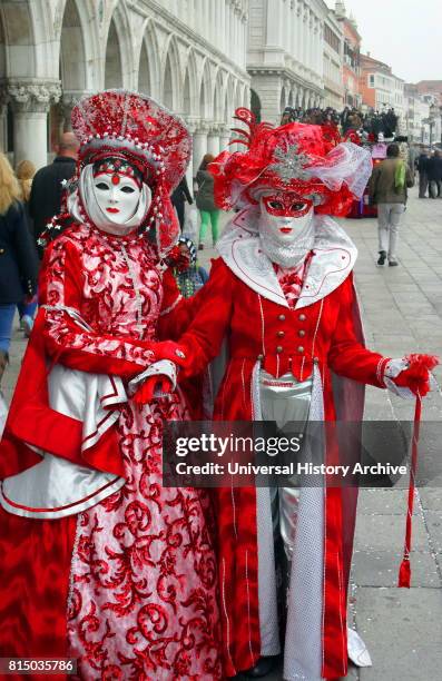 Costumed attendees at the Venice Carnival , an annual festival held in Venice, Italy. Started to recall a victory of the 'Serenissima Repubblica'...