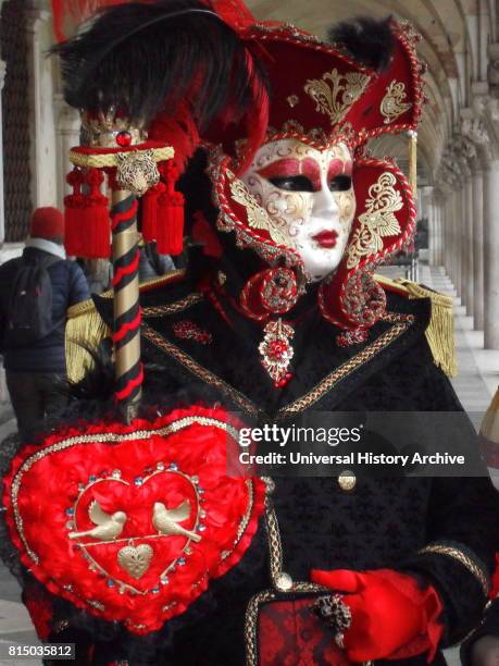 Costumed attendee at the Venice Carnival , an annual festival held in Venice, Italy. Started to recall a victory of the 'Serenissima Repubblica'...