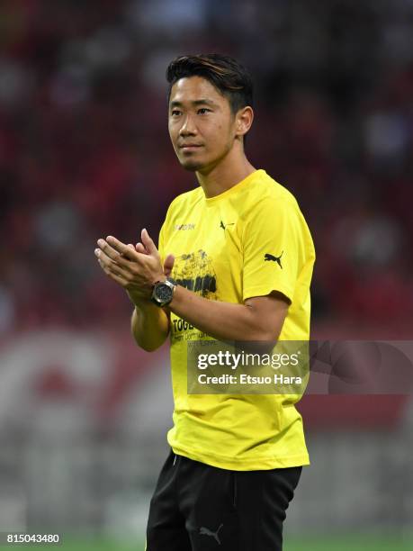 Shinji Kagawa of Burussia Dortmund applauds fans after the preseason friendly match between Urawa Red Diamonds and Borussia Dortmund at Saitama...