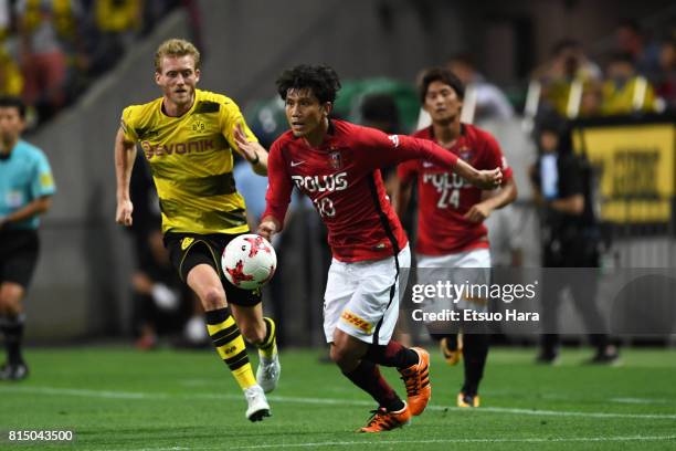 Yosuke Kashiwagi of Urawa Red Diamonds in action during the preseason friendly match between Urawa Red Diamonds and Borussia Dortmund at Saitama...