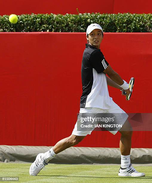 Tawainese player Yen-Hsun Lu plays against Australian Chris Guccione during the first round match on the first day of The Artois Championships at The...