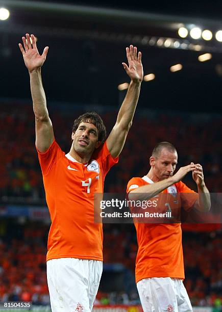 Ruud van Nistelroy and Andre Ooijer of Netherlands celebrate victory after the Euro 2008 Group C match between Netherlands and Italy at Stade de...