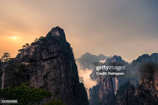 huangshan with sea of clouds, anhui province, china - huangshan mountains stock pictures, royalty-free photos & images