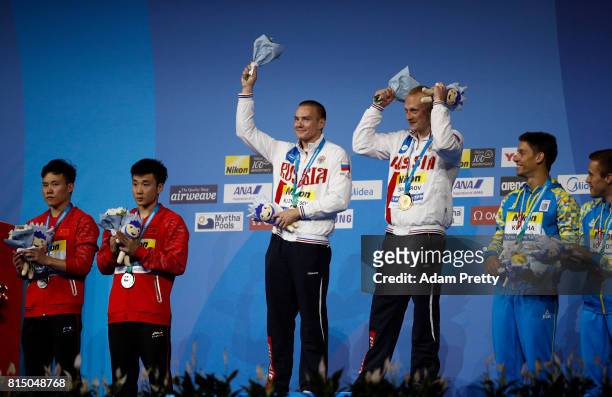 Silver medalists Yuan Cao and Siyi Xie of China gold medalists Evgenii Kuznetsov and Ilia Zakharov of Russia and bronze medalists Oleg Kolodiy and...