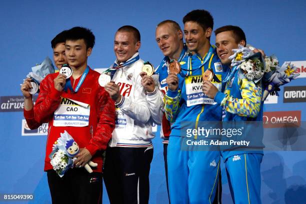 Silver medalists Yuan Cao and Siyi Xie of China gold medalists Evgenii Kuznetsov and Ilia Zakharov of Russia and bronze medalists Oleg Kolodiy and...