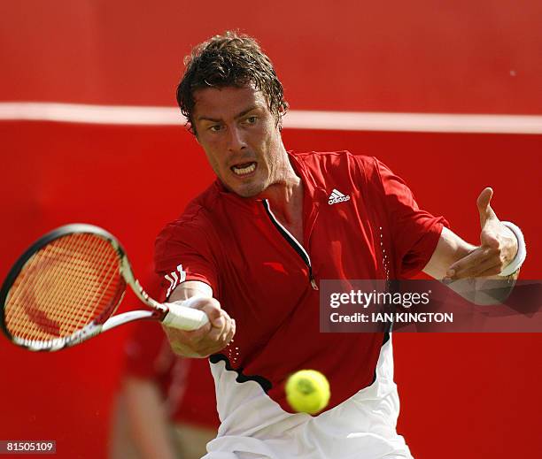 Russian player Marat Safin plays against British player James Ward on the first day of The Artois Championships at The Queen's Club tennis tournament...