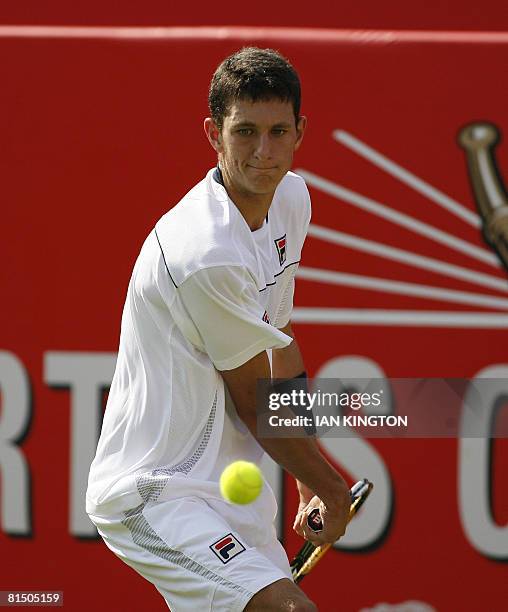 British player James Ward plays against Russian player Marat Safin on the first day of The Artois Championships at The Queen's Club tennis tournament...