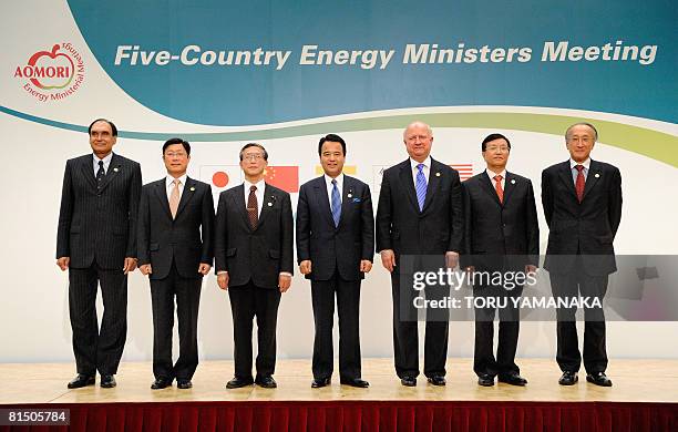 Head of delegations pose for photographers during the photo session of the five-nation energy ministers meeting in Aomori, northern Japan, on June 7,...