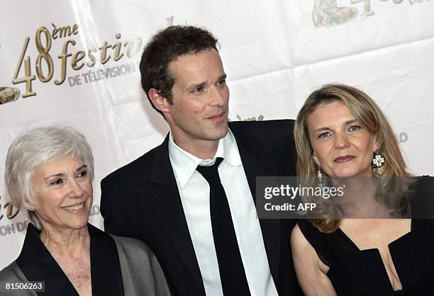 French actors Nadine Alari, Guillaume Cramoisan and Sophie de La Rochefoucauld from the TV show "Le reveillon des bonnes" pose upon their arrival at...