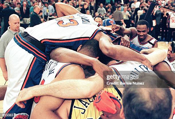 New York Knicks players celebrate after winning the third game in best of seven Eastern Conference Finals, June 5, 1999 at Madison Square Gardens in...