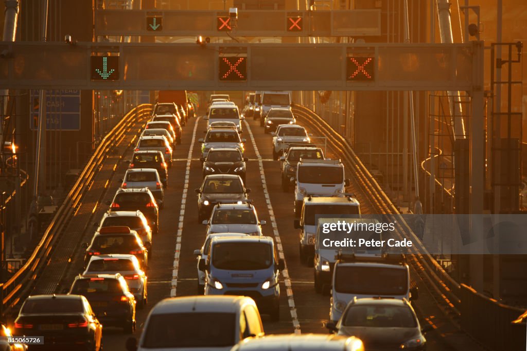 Heavy traffic on bridge at sunset