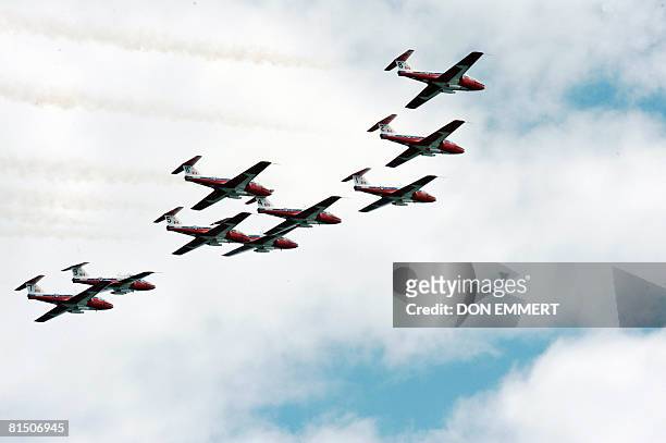Members of the Snowbirds precision squadron fly over the Canadian Formula One Grand Prix June 8, 2008 at the Circuit Gilles Villeneuve track in...