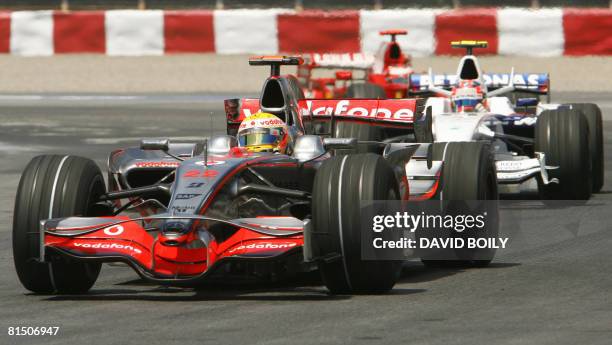 McLaren Mercedes driver Lewis Hamilton of the United Kingdom leads BMW Sauber F1 driver, Robert Kubica of Poland at the exit of the hairpin turn...