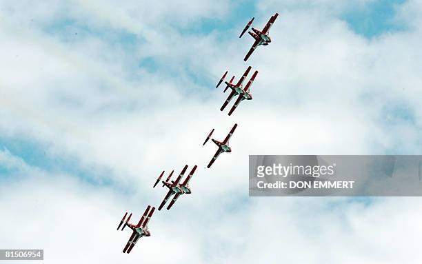 Members of the Snowbirds precision squadron fly over the Canadian Formula One Grand Prix June 8, 2008 at the Circuit Gilles Villeneuve track in...