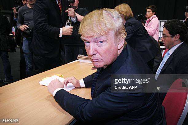 Property tycoon Donald Trump is pictured before a public inquiry over his plans to build a golf resort near Aberdeen, at the Aberdeen Exhibition &...