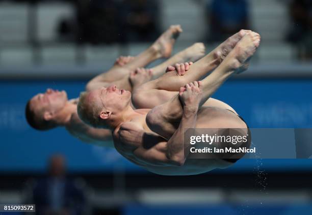 Evgenil Kuznetsov and Ilia Zakharov of Russia compete in the final of the Men's 3m Synchro Springboard during day two of The FINA World Championships...