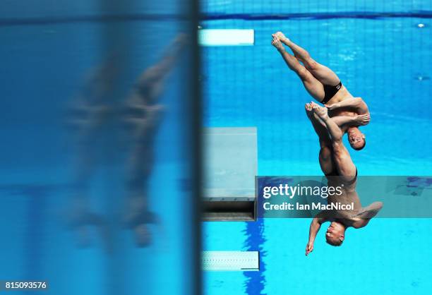 Evgenil Kuznetsov and Ilia Zakharov of Russia compete in the final of the Men's 3m Synchro Springboard during day two of The FINA World Championships...