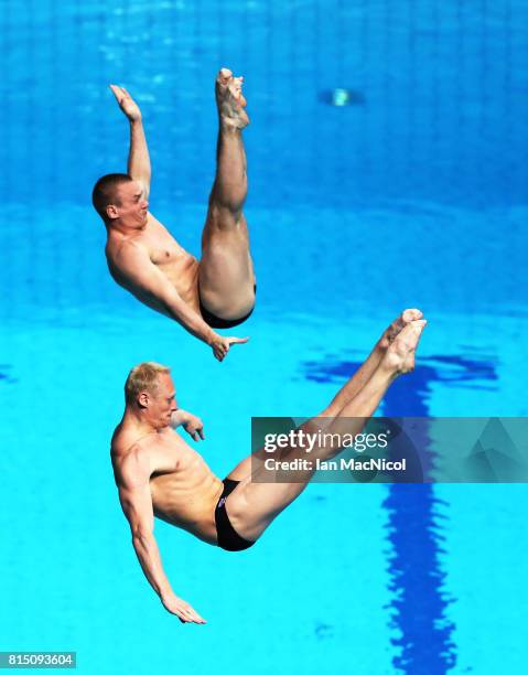 Evgenil Kuznetsov and Ilia Zakharov of Russia compete in the final of the Men's 3m Synchro Springboard during day two of The FINA World Championships...