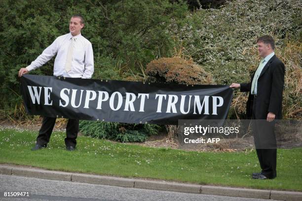 Supporters of US tycoon Donald Trump are pictured outside the Aberdeen Exhibition & Conference centre where Donald Trump attends a public inquiry...