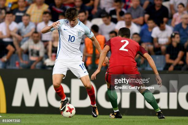 Mason Mount of England in action with Diogo Dalot of Portugal during the UEFA European Under-19 Championship Final between England and Portugal on...