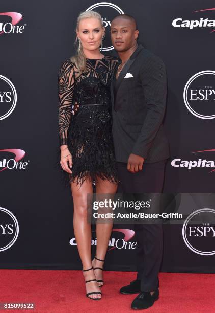 Olympic skier Lindsey Vonn and former NFL coach Kenan Smith arrive at the 2017 ESPYS at Microsoft Theater on July 12, 2017 in Los Angeles, California.